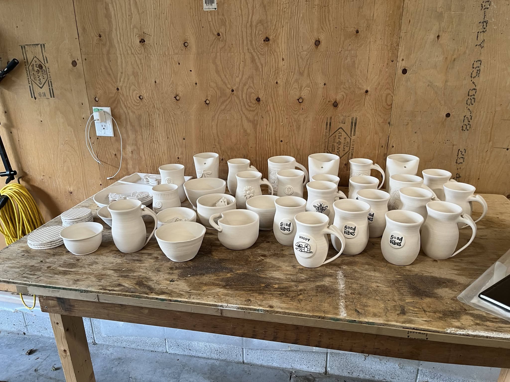 Handmade pottery mug by Mary Jane Corda, The Random Mugger Pottery, on display at Wrobel Massage Therapy